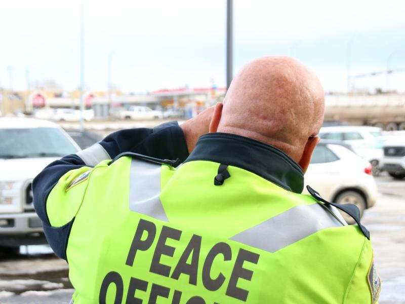 A Peace Officer using a radar gun