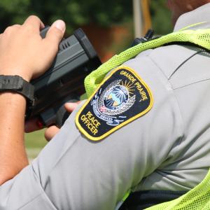 A Peace Officer holding speed Lidar